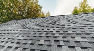 new renovated roof covered with shingles flat polymeric roof-tiles
